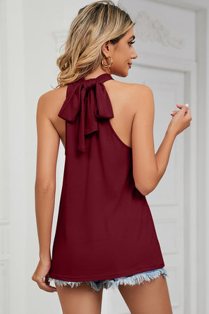 Burgundy halter tank top with a high neck and a bow detail on the back.