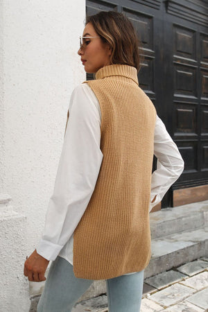 Khaki ribbed knit turtleneck vest with side buttons, worn over a white shirt.