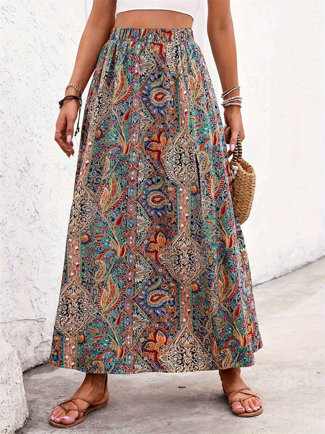 Paisley print maxi skirt with slit in multicolor, bohemian style, elastic waist, and side slit.