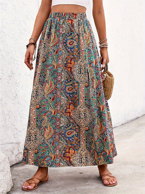 Paisley print maxi skirt with slit in multicolor, bohemian style, elastic waist, and side slit.