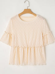 Beige textured blouse with ruffled short sleeves and a ruffled hemline.