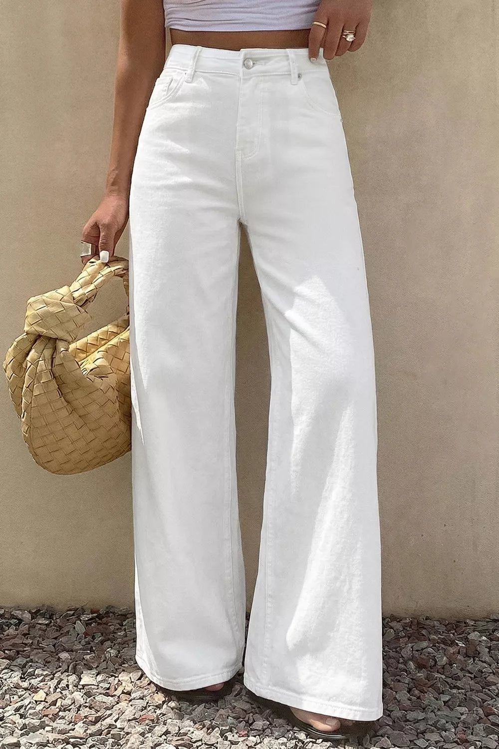 White denim casual wide-leg high-waisted jeans with button fly.
