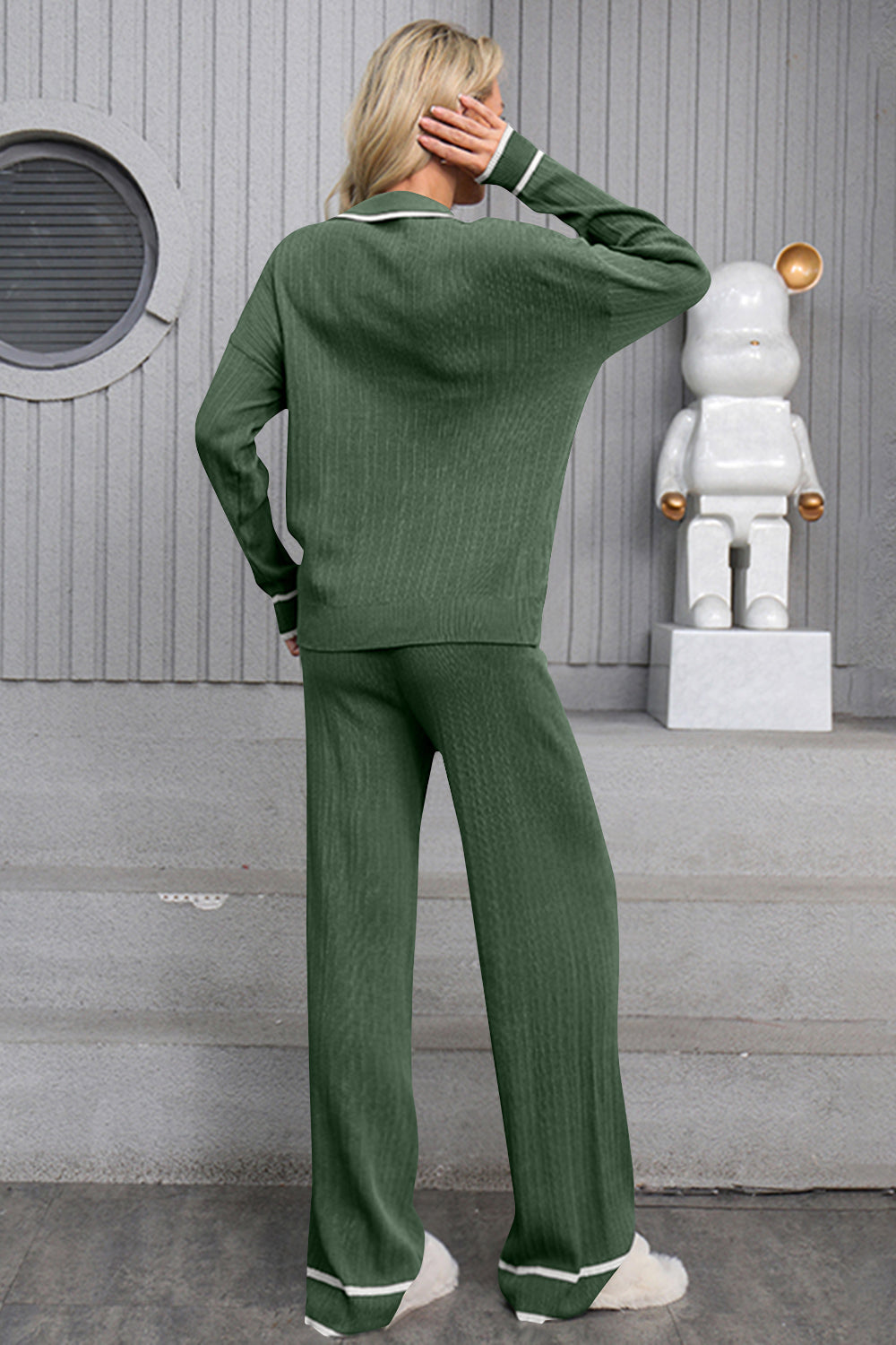 Dark green ribbed knit loungewear set with contrast trim on collar and cuffs.