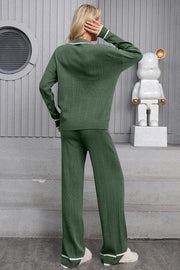 Dark green ribbed knit loungewear set with contrast trim on collar and cuffs.