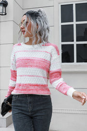 Ombre stripe knit sweater in pink and white acrylic with a crew neck and long sleeves.