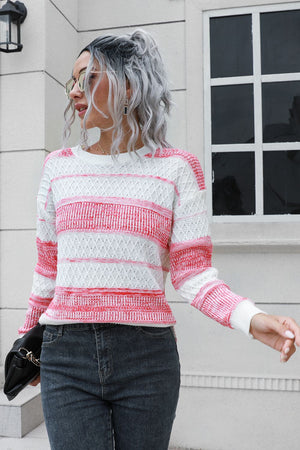Ombre stripe knit sweater in pink and white acrylic with a crew neck and long sleeves.