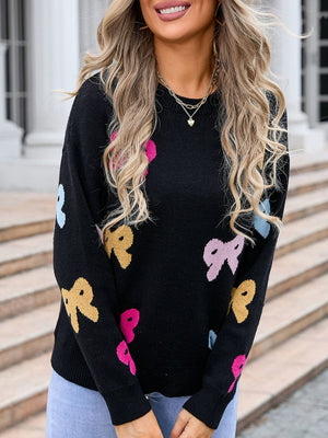 Black knit sweater with colorful bow motif, crew neck, long sleeves.
