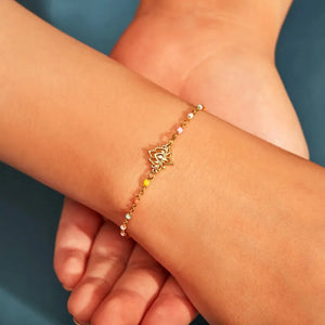 Gold enamel lotus bead bracelet with colorful accents