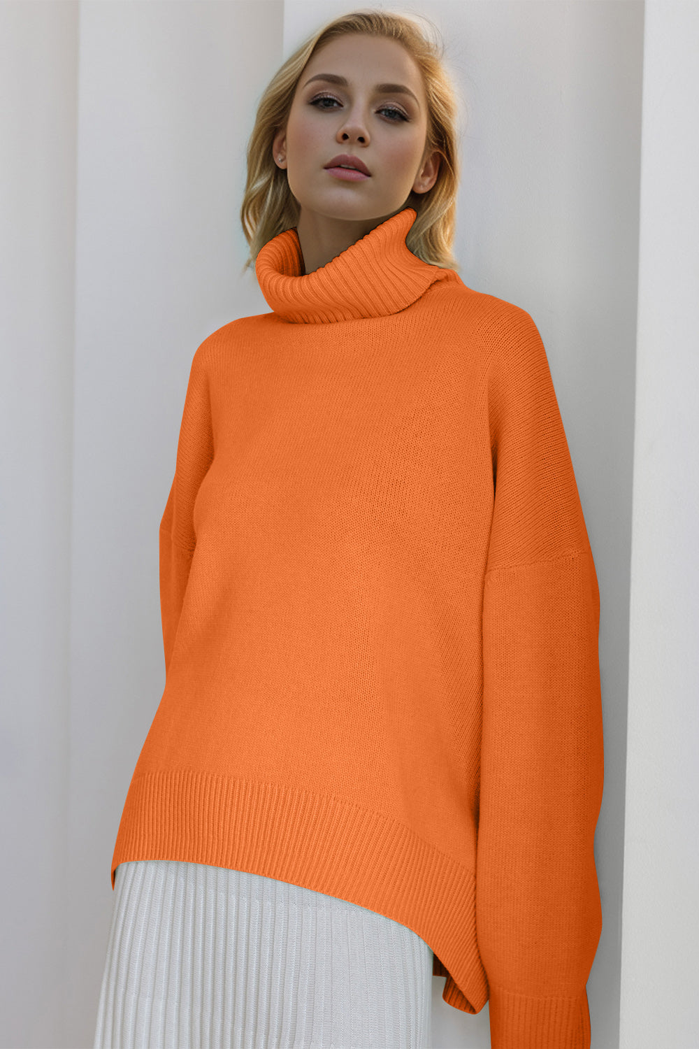 Oversized orange cashmere turtleneck sweater with ribbed cuffs and hem.