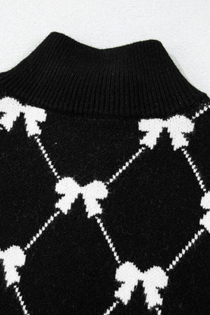 Black knit zip vest with white diamond bow pattern and mock neck.