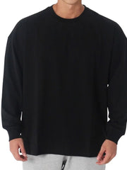 Black oversized crewneck washed cotton tee with long sleeves.