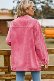 Oversized coral denim trucker jacket with classic buttoned details and a relaxed fit.