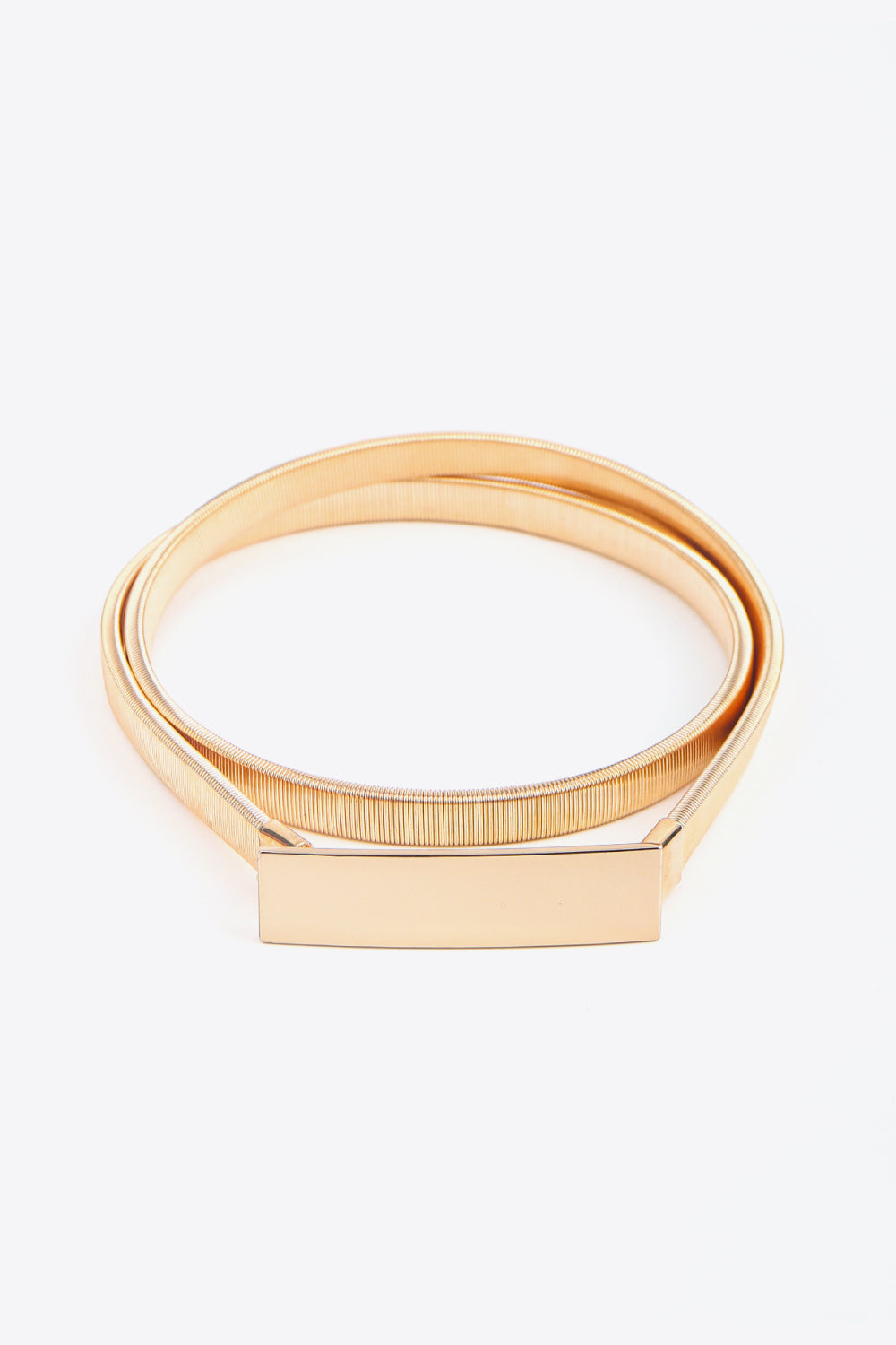Slimline gold-tone elastic waist belt with a rectangular buckle.