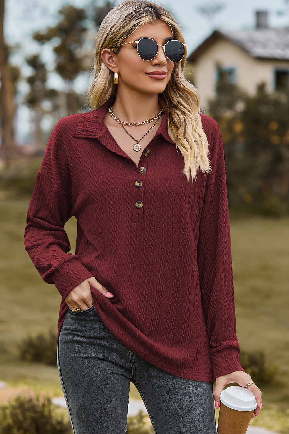 Burgundy textured polo-neck sweater with button detail and long sleeves.