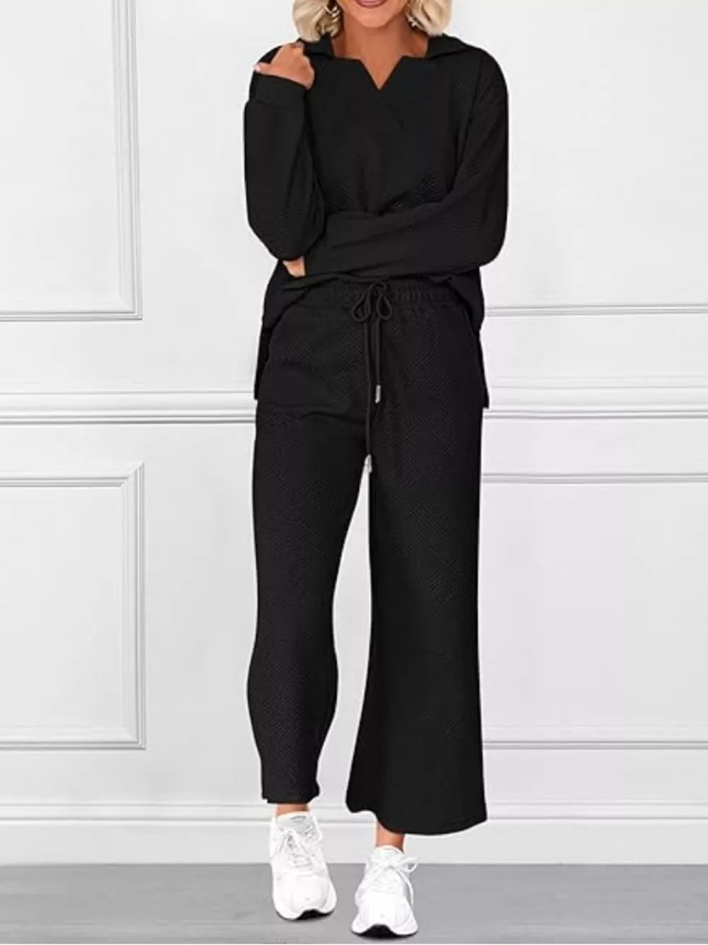 Black V-neck textured two-piece lounge set with diagonal pattern and drawstring pants.