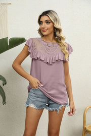 Blush pink blouse with lace yoke, ruffle trim and short flutter sleeves.