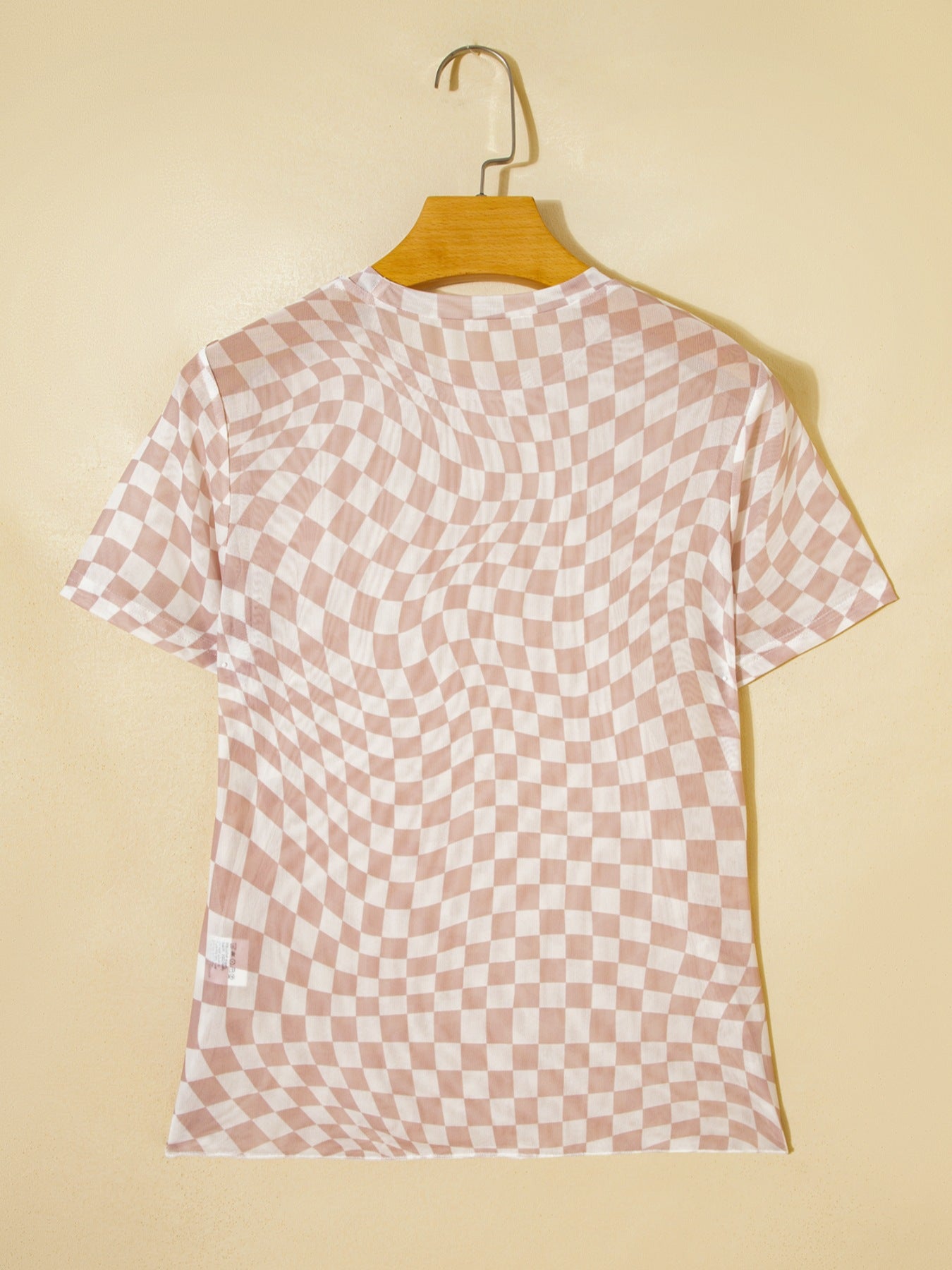 Beige checkered mesh crew neck t-shirt with short sleeves.