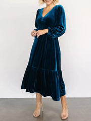 Peacock blue velvet midi dress with tiered skirt and puff sleeves.