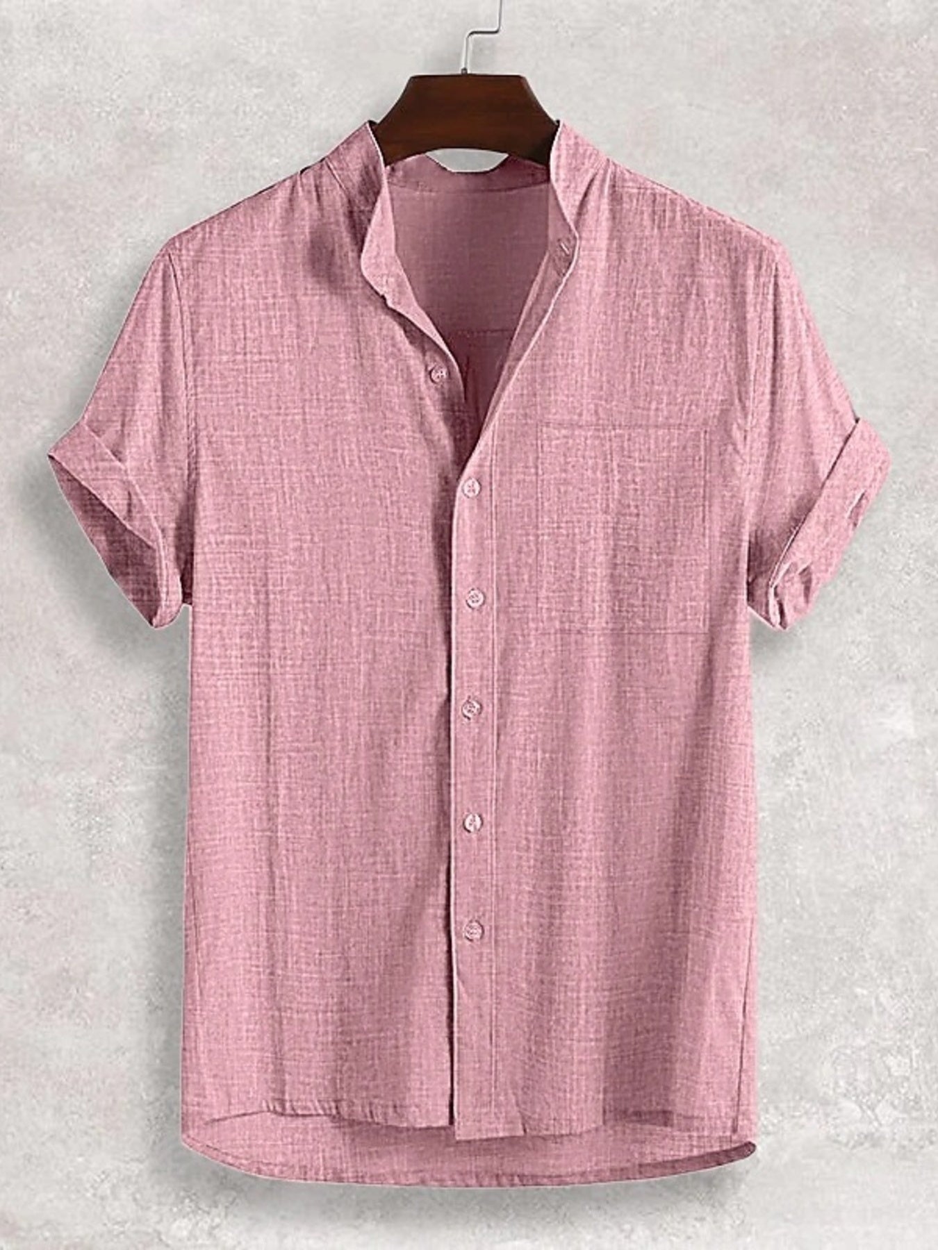 Pink textured band collar casual shirt with short sleeves and button front.