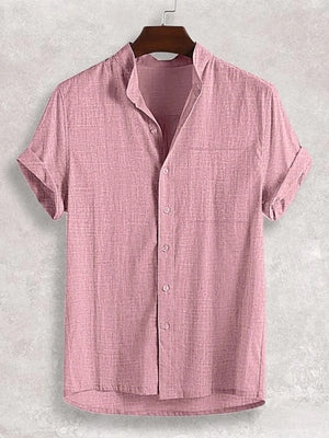 Pink textured band collar casual shirt with short sleeves and button front.