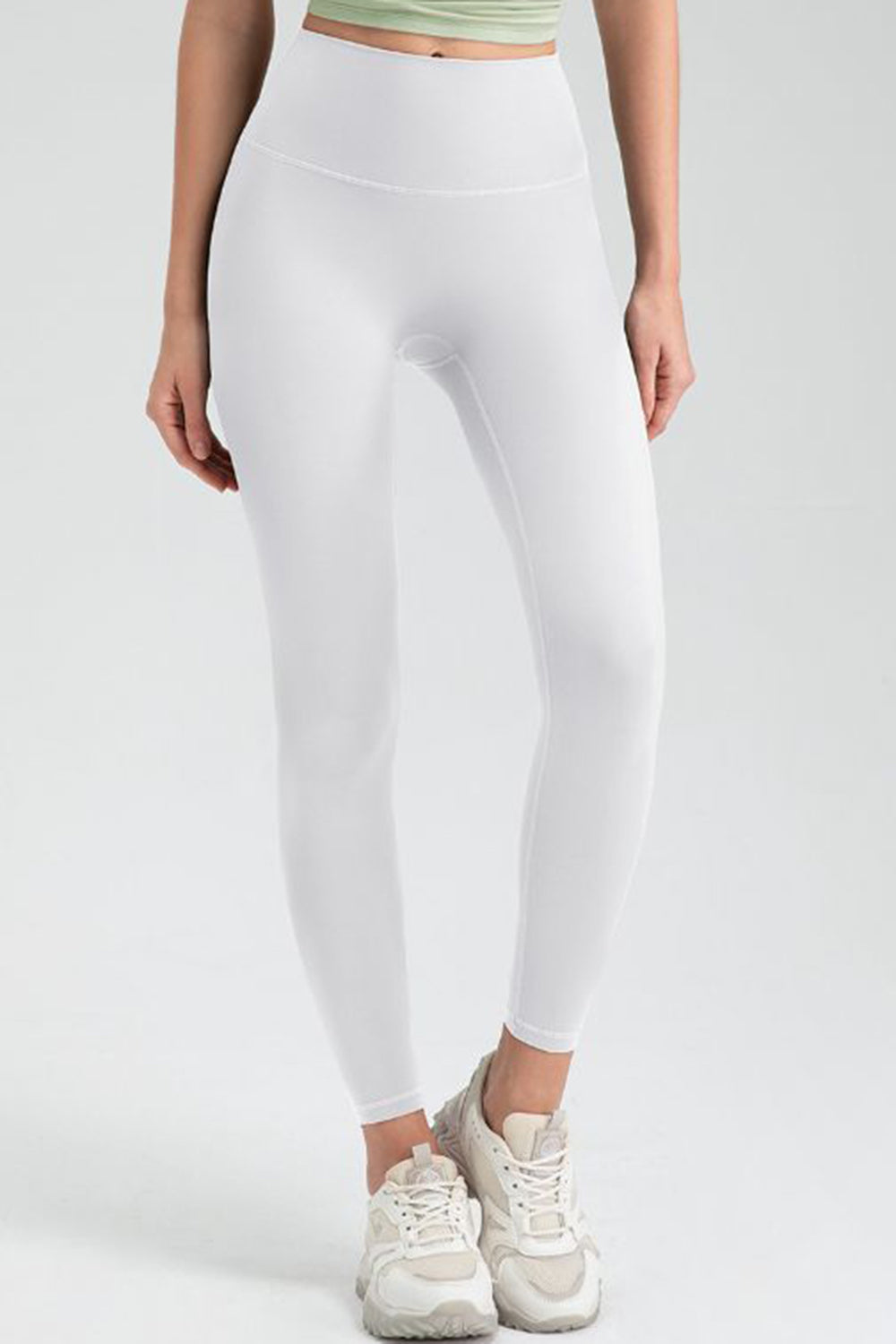 White high rise leggings with a seamless design and athletic fit.
