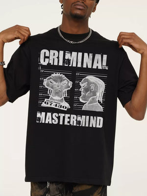 Black cotton oversized tee with a bold white "CRIMINAL MASTERMIND" graphic print and mugshot illustrations.