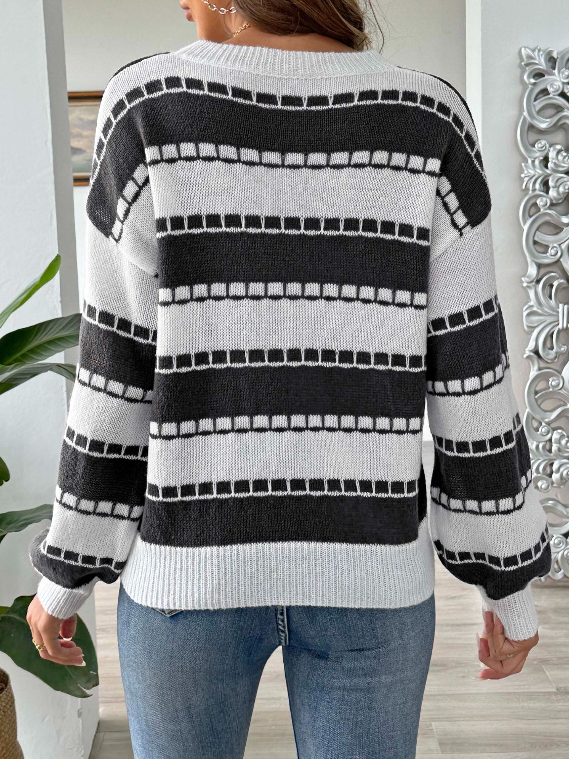 Textured stripe crewneck sweater in black and white with a relaxed fit.