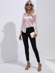 Blush pink satin tie-front blouse with buttoned cuffs and collar