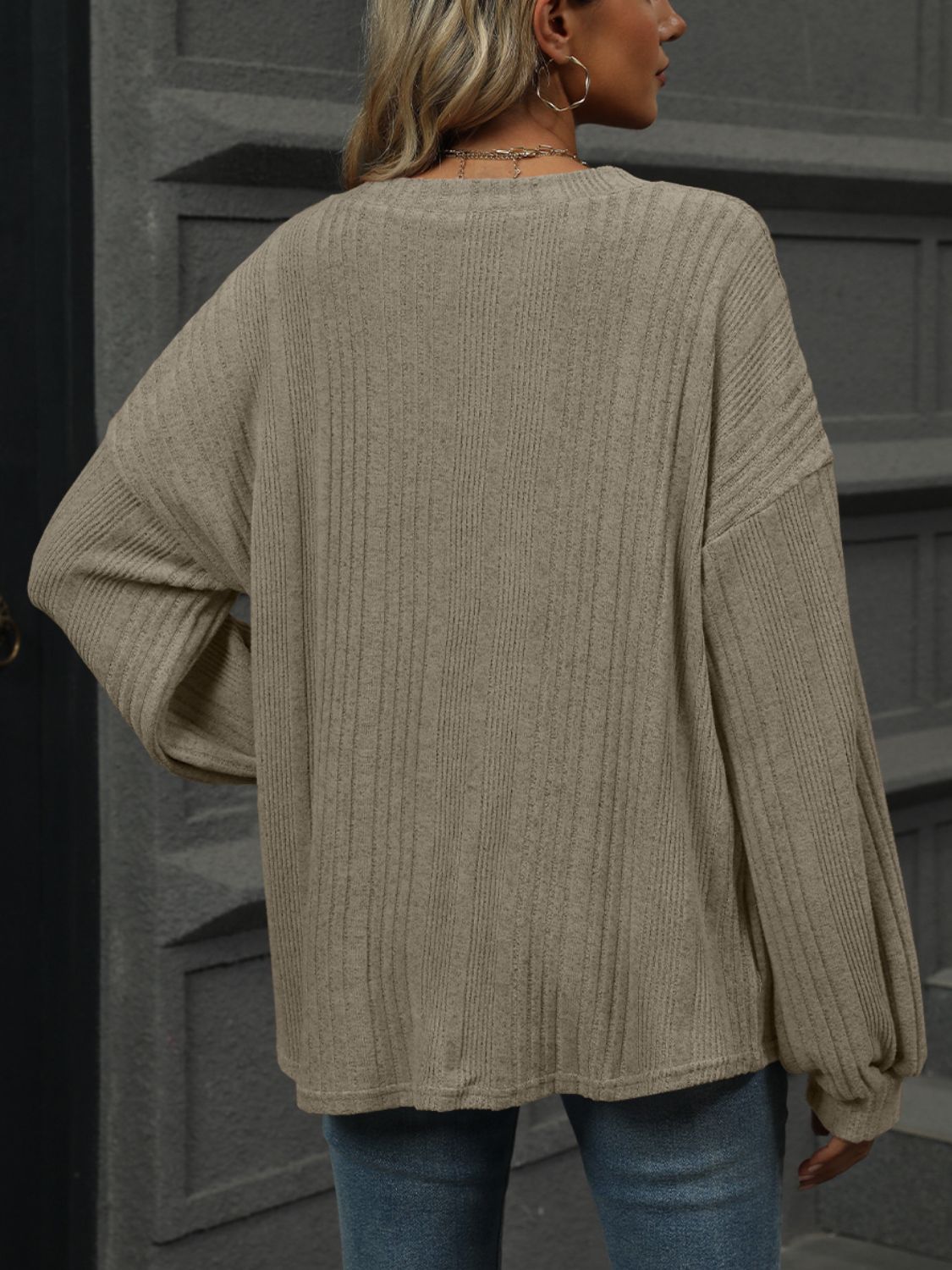 Textured ribbed V-neck top in khaki with blouson sleeves.