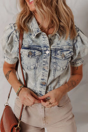 Cropped denim bolero jacket in medium wash with puff sleeves and distressed details.