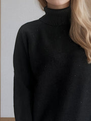 Black ribbed turtleneck sweater with subtle sparkle detail