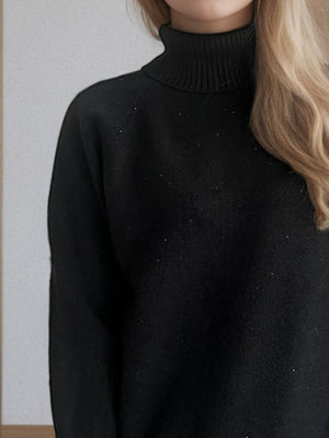 Black ribbed turtleneck sweater with subtle sparkle detail