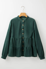 Dark green corduroy tiered button-up blouse with a band collar and long sleeves.