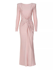 Pink ruched long sleeve maxi dress with boat neckline and knot detail