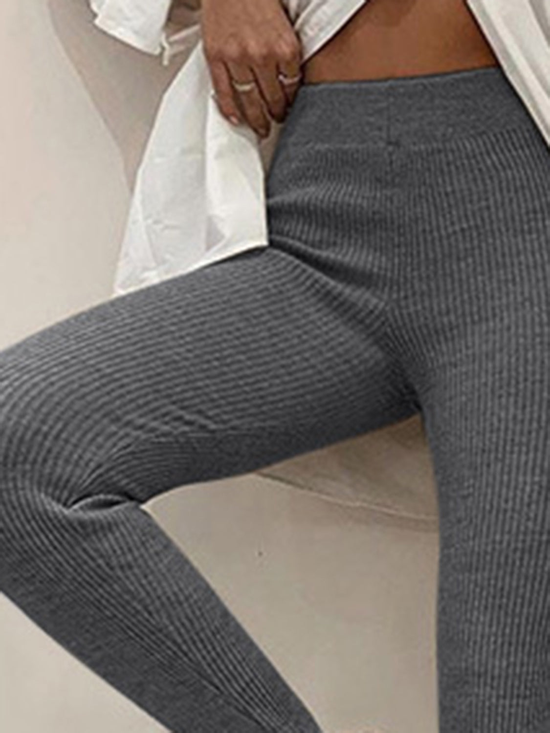 Charcoal ribbed knit stirrup leggings with a high waist.