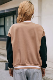 Camel bomber jacket with black sleeves and striped ribbed hem