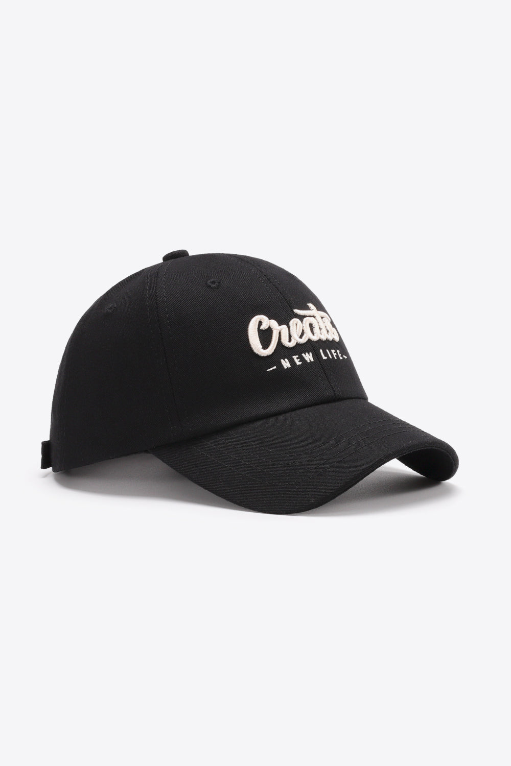 Black baseball cap with white embroidered "Create New Life" text detail