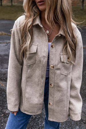 Fleece textured utility shirt jacket in Dust Storm with button front and chest pockets.