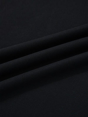 Black sheer mesh fabric detail of a cap sleeve t-shirt