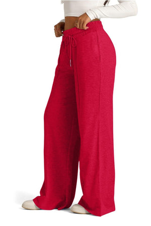Red seamed palazzo lounge trousers with drawstring waist and wide leg.
