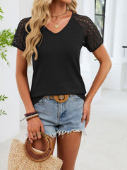 Black waffle knit t-shirt with lace short sleeves and V-neck.
