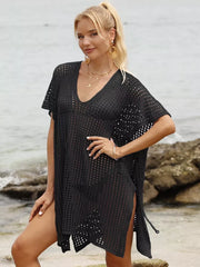 Black textured V-neck ruched maternity cover-up with short sleeves and side slits.