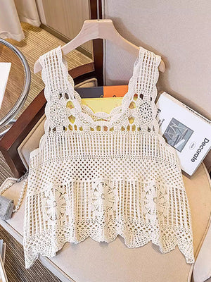 Cream crochet tank top with floral overlay and scalloped hem.
