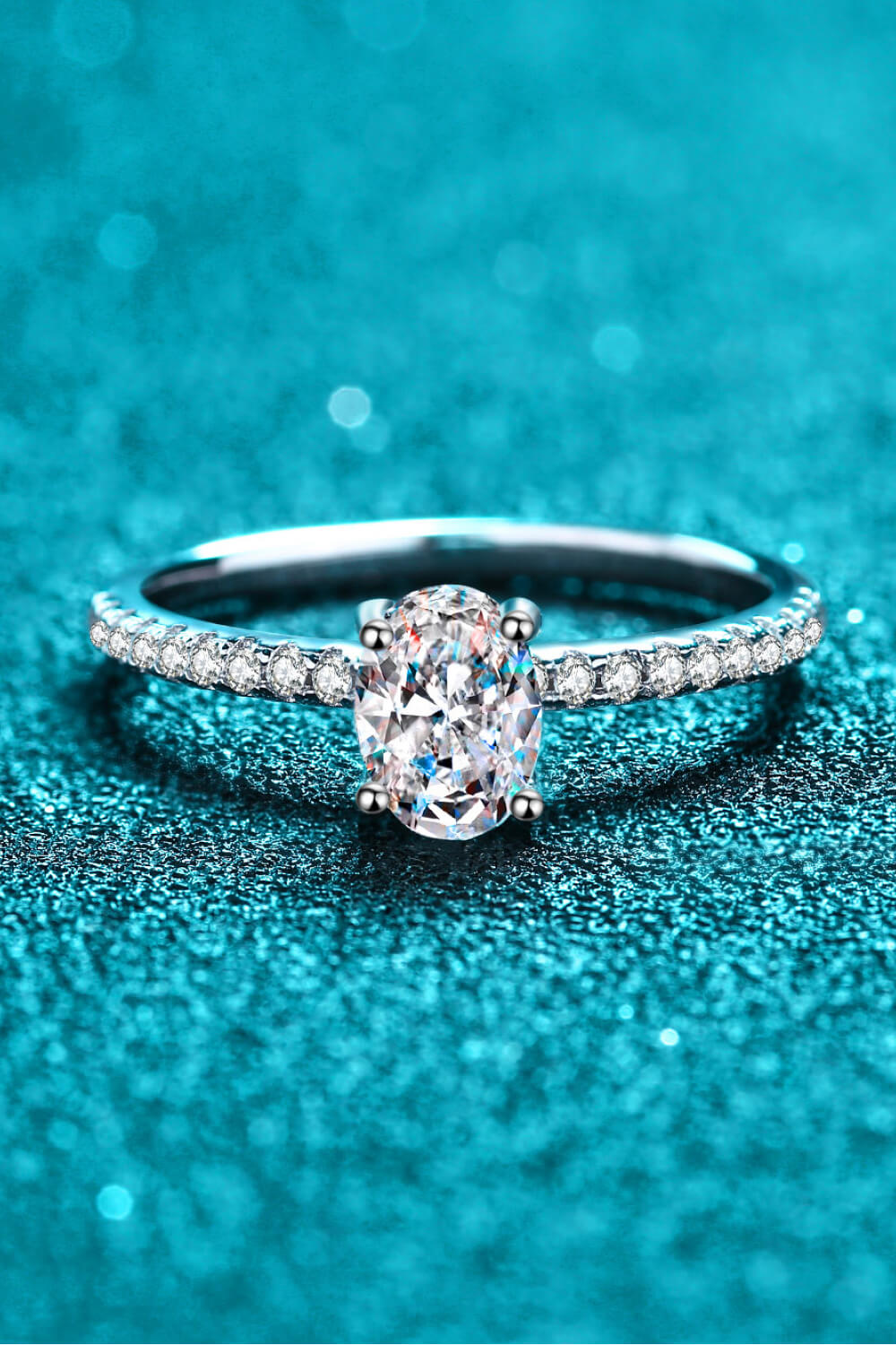 Silver oval moissanite ring with pavé band