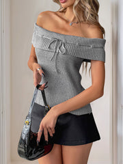 Gray ribbed knit off-shoulder blouse with bow detail and short sleeves.