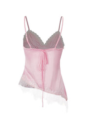 Pink satin camisole with lace trim and asymmetrical hem, tie back detail.