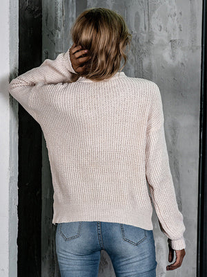 Openwork knit crew neck pullover in blush pink with balloon sleeves.