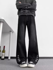 Men's black wide-leg jeans with star embellishments on the cuffs, made of 100% cotton.
