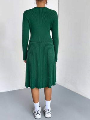 Green ribbed knit fit-and-flare co-ord set with a long sleeve top and pleated midi skirt.
