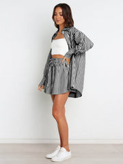 Oversized black and white stripe shirting set with a button-up shirt and drawstring shorts.